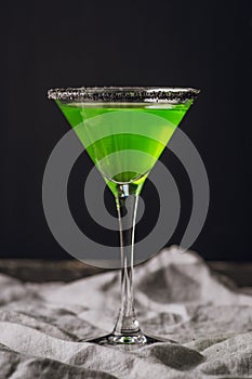 Green martini cocktail for halloween party. Selective focus. Shallow depth of field