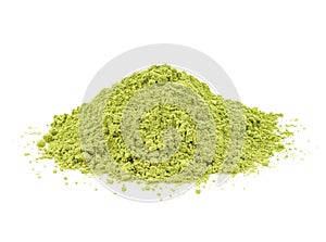 Green matcha powder on white background. Matcha made from finely ground green tea powder