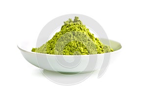 Green matcha tea powder.