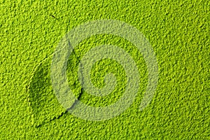 Green matcha tea powder with tea leaf