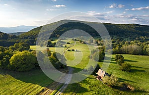 Green meadow with forest from drone with nice hill, Slovakia - Pohronsky Inovec