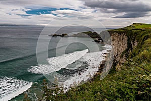 Green meadows in northern ireland along the coast of antrim