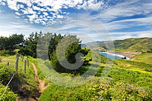 Green meadows and view of the Pacific Ocean at Point Bonita, California