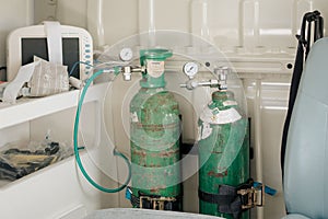 Green medical oxygen cylinders with other hospital equipment
