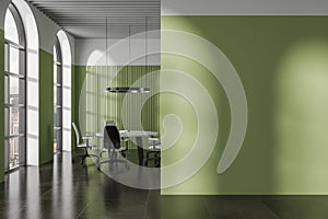 Green meeting room interior with round table and mock up wall