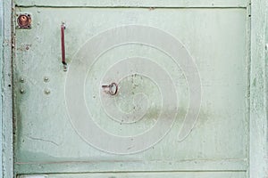 green metal door texture with a keyhole. Vintage metal texture.