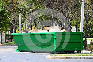 Green metal dumpster, South Florida