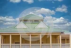 Green Metal Roof on Yellow Building