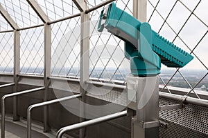 Green metal tower viewer on observation deck