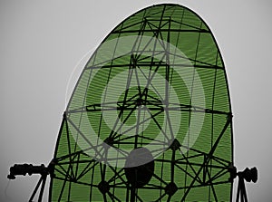 Green metallic army radars with sky background photo