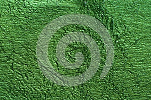 Green metallic foil background texture