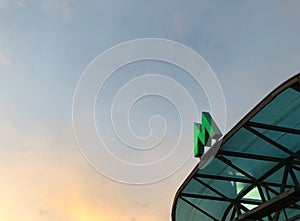 Green metro sign on the visor of entrance