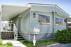 Green Mobile Home on a Sunny Day - Rehabbed Unit - Double Wide - Real Estate Investment - Mobile Home Park photo