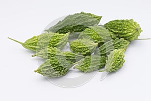 Green Momordica or karela with leaf isolate on white