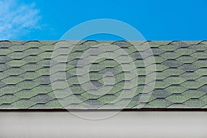 Green mosaic tile roof house structure exterior abstract building home pattern design object blue sky background