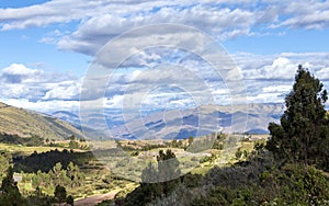 Green mountain landscape with Inca ruins of fortress Puka Pukara, Cusco Region, Peru