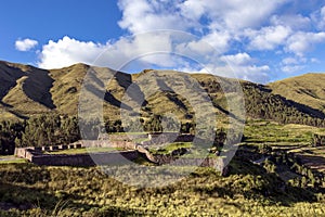 Green mountain landscape with Inca ruins of fortress Puka Pukara, Cusco Region, Peru photo