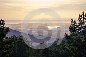 green mountain landscape, at sunrise with golden tones and a view of the horizon with large areas of land. La Morcuera Madrid photo