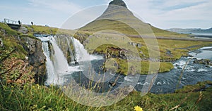 green mountain peak and kirkjufellsfoss fall is popular attractions at morning at Iceland, Summertime outdoor trip