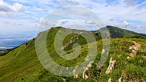 Green mountain ridge in nice weather, with blue sky and white clouds. Mala Fatra