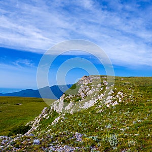 green mountain valley under a cloudy sky