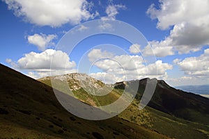 Green mountains with clouds