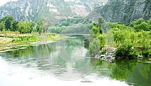 Green mountains and green waters in the mountains in summer are picturesque.