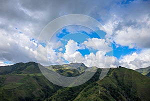 Green mountains panorama under cloudy sky spectacular landscape. Rural land scenery. Summer travel hiking in green hills