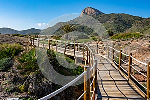 Green mountains and sandy beaches of regional park of Calblanque, Monte de las Cenizas and PeÃÂ±a del Aguila in Spain photo