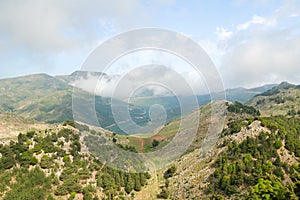 Green mountains and white clouds on the island of Crete