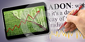 A green mowed lawn with a diagonal crack with radon gas escaping - Chart concept image with 3D render of a digital tablet