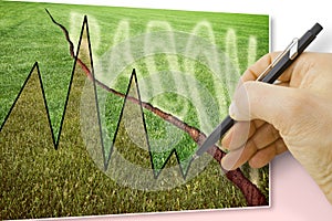 A green mowed lawn with a diagonal crack with radon gas escaping - concept image with hand drawing a chart about radon issue