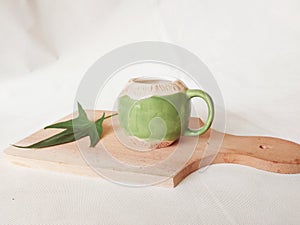 green mug as a place for cold drinks