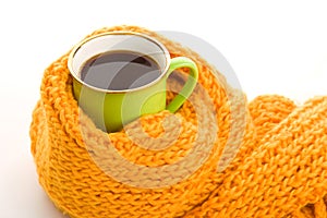 Green mug wrapped yellow scarf