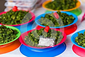 Green nama in plates at the local market, Fiji. Close-up