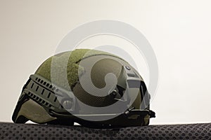 Green nato military helmet on white background