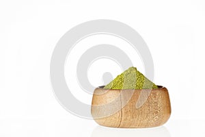 Green and natural moringa powder in a bowl - Moringa oleifera