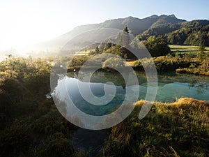 Green nature landscape panorama at idyllic clear blue spring Zelenci lake pond near Kranjska Gora Julian Alps Slovenia