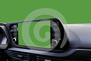 Green navigation screen on dashboard and green windscreen from inside of car
