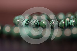 Green necklace of beads of malachite