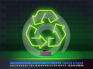 Green neon light recirculates the ecology sign isolated on the stand. Neon alphabet. Triangle waste eco arrow Save the concept of