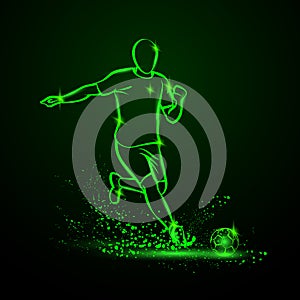 Green Neon soccer striker. Football player hits the ball in the dark under the rain photo