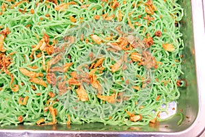 Green noodles on the pan from Thai buffet style. photo