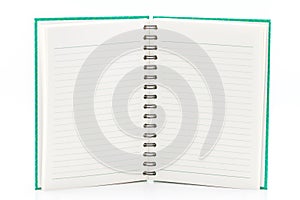 Green notebook open.