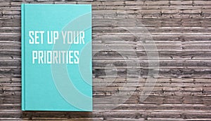 Green notepad with text Prioritize