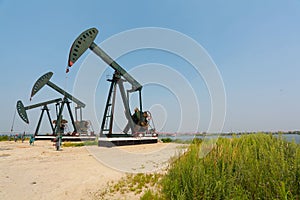 Green Oil pump of crude oilwell rig photo
