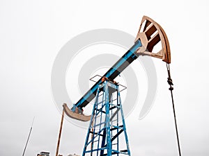 Green Oil pump oil rig energy industrial machine for petroleum crude. oil crisis. Russia pumps oil pollution.