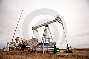 Green Oil pump oil rig energy industrial machine for petroleum crude. oil crisis. Russia pumps oil pollution