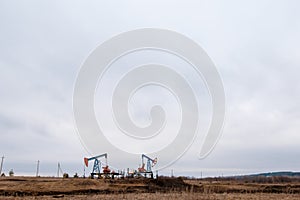 Green Oil pump oil rig energy industrial machine for petroleum crude. oil crisis. Russia pumps oil pollution