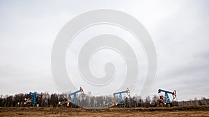 Green Oil pump oil rig energy industrial machine for petroleum crude. oil crisis. Russia pumps oil pollution